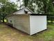 A white outbuilding structure with a ladder propped on its side at 2350 Grubb Ferry Rd, Salisbury, NC 28144