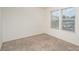 Neutral bedroom featuring two windows, neutral carpet and light colored walls at 2507 Waverly Dr, Monroe, NC 28112