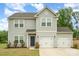 Two-story home featuring gray siding, an attached two-car garage, and a well-maintained front lawn at 2507 Waverly Dr, Monroe, NC 28112
