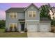 Two-story home featuring gray siding, an attached two-car garage, and a well-maintained front lawn at 2507 Waverly Dr, Monroe, NC 28112