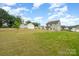 Spacious yard featuring a well-manicured lawn and surrounding greenery at 2507 Waverly Dr, Monroe, NC 28112