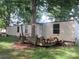 Exterior view of a one-story home and a deck with benches at 2927 S Nc 16 Hwy, Newton, NC 28658