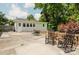 Spacious concrete patio with outdoor seating and wooden railing, perfect for entertaining and enjoying the backyard at 3307 Draper Ave, Charlotte, NC 28205