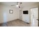 Bedroom with wood-look floors, ceiling fan, neutral walls, and TV mount installed at 3307 Draper Ave, Charlotte, NC 28205