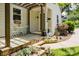 Charming front porch with stone steps, pergola, and a cozy seating area, perfect for relaxing outdoors at 3307 Draper Ave, Charlotte, NC 28205
