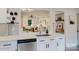 Modern kitchen with white cabinets, stainless steel appliances, and an open view to the living room at 3307 Draper Ave, Charlotte, NC 28205