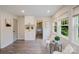 Cozy sitting room with a view of the outdoors, neutral tones, and wood-style flooring at 3307 Draper Ave, Charlotte, NC 28205