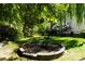 Lush backyard featuring a beautiful garden and well-maintained lawn, perfect for outdoor activities at 4003 Northerly Island Ct, Gastonia, NC 28056