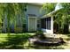 Serene backyard with screened porch, garden area and lush landscaping for relaxation at 4003 Northerly Island Ct, Gastonia, NC 28056