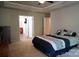 A bedroom with carpet and neutral walls leads to the bathroom and closet at 4003 Northerly Island Ct, Gastonia, NC 28056