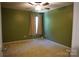 Cozy bedroom with green walls, ceiling fan, and natural light streaming through the window at 4003 Northerly Island Ct, Gastonia, NC 28056