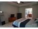 Carpeted bedroom leading into bathroom and closet; features tv and drawers at 4003 Northerly Island Ct, Gastonia, NC 28056