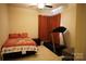 Inviting bedroom featuring a comfortable bed and fitness equipment, perfect for relaxation and exercise at 4003 Northerly Island Ct, Gastonia, NC 28056