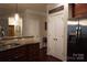 Open kitchen with granite counters, stainless appliances, and access to hallways at 4003 Northerly Island Ct, Gastonia, NC 28056