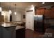 Kitchen with stainless steel fridge, granite countertops, and center island with sink at 4003 Northerly Island Ct, Gastonia, NC 28056
