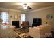 Inviting living room with fireplace, ceiling fan, plush seating and view to kitchen at 4003 Northerly Island Ct, Gastonia, NC 28056