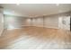 Spacious unfinished basement with light wood flooring and a stairway at 4028 Spindrift Cove Dr # 59 And 60, Denver, NC 28037