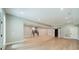 Spacious finished basement with light wood flooring, recessed lights, bar area and barn doors at 4028 Spindrift Cove Dr # 59 And 60, Denver, NC 28037