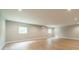 Spacious unfinished basement with two windows and light wood flooring at 4028 Spindrift Cove Dr # 59 And 60, Denver, NC 28037