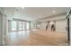 Open basement with recessed lighting, wood floors, large windows, and double doors that lead to the backyard at 4028 Spindrift Cove Dr # 59 And 60, Denver, NC 28037