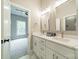 Modern bathroom boasts double sinks, quartz countertops, and stylish fixtures with an adjacent bedroom at 4028 Spindrift Cove Dr # 59 And 60, Denver, NC 28037