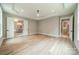 Bright bedroom features an elegant trey ceiling, light paint, and access to the ensuite bathroom at 4028 Spindrift Cove Dr # 59 And 60, Denver, NC 28037