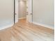 Bedroom with hardwood floors and open doors to the other rooms at 4028 Spindrift Cove Dr # 59 And 60, Denver, NC 28037