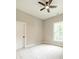 Bright bedroom features neutral walls, plush carpet, a ceiling fan, and natural light from the window at 4028 Spindrift Cove Dr # 59 And 60, Denver, NC 28037