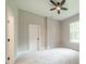 Neutral bedroom with a ceiling fan, window, and neutral carpet at 4028 Spindrift Cove Dr # 59 And 60, Denver, NC 28037