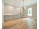 Dining area featuring hardwood floors, neutral colors, modern light fixtures, and natural light at 4028 Spindrift Cove Dr # 59 And 60, Denver, NC 28037
