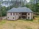 Back of home with multi-level deck, patio, and brick exterior at 4028 Spindrift Cove Dr # 59 And 60, Denver, NC 28037