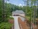 Brick home with an attached two-car garage and modern landscaping at 4028 Spindrift Cove Dr # 59 And 60, Denver, NC 28037