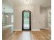 Grand foyer featuring an ornate black metal door, light hardwood floors, and neutral walls at 4028 Spindrift Cove Dr # 59 And 60, Denver, NC 28037