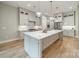 Bright kitchen with a large center island, stainless steel appliances, and pendant lighting at 4028 Spindrift Cove Dr # 59 And 60, Denver, NC 28037