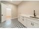 Laundry room with stylish backsplash, white cabinets, and modern fixtures at 4028 Spindrift Cove Dr # 59 And 60, Denver, NC 28037