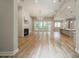 Expansive living room boasts a stone fireplace, hardwood floors, and plenty of natural light at 4028 Spindrift Cove Dr # 59 And 60, Denver, NC 28037