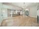 Open-concept living space with hardwood floors, a modern kitchen, and ample natural light at 4028 Spindrift Cove Dr # 59 And 60, Denver, NC 28037