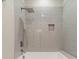 Contemporary shower features gray subway tile, a rainfall shower head, and a built-in niche for storage at 4028 Spindrift Cove Dr # 59 And 60, Denver, NC 28037