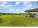 Spacious backyard with covered patio, perfect for outdoor gatherings and relaxation at 410 Alucio Ct, Matthews, NC 28104
