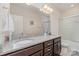 This bathroom features granite countertops and dual sinks at 410 Alucio Ct, Matthews, NC 28104