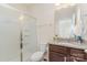 Bathroom with a shower and glass door plus granite countertop on vanity cabinet at 410 Alucio Ct, Matthews, NC 28104