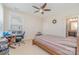 Bedroom with a ceiling fan, neutral walls, window, and view to the outside at 410 Alucio Ct, Matthews, NC 28104