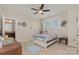 This cozy bedroom is enhanced by a ceiling fan and natural light at 410 Alucio Ct, Matthews, NC 28104