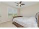 This bedroom features neutral paint, a window, and a bed at 410 Alucio Ct, Matthews, NC 28104