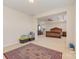 Large bedroom with a tray ceiling, carpet flooring, and a view to other rooms at 410 Alucio Ct, Matthews, NC 28104