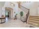 Grand foyer with soaring ceilings, elegant staircase, and decorative tile flooring at 410 Alucio Ct, Matthews, NC 28104