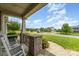 Inviting front porch with rocking chairs offering a relaxing outdoor space at 410 Alucio Ct, Matthews, NC 28104
