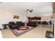 Open-concept living room with a fireplace and views into the kitchen and dining area at 410 Alucio Ct, Matthews, NC 28104