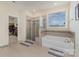 This beautiful bathroom boasts a soaking tub, separate shower, and a walk-in closet at 410 Alucio Ct, Matthews, NC 28104