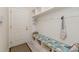Mudroom with a built-in bench, shelves, and a door to the outside at 410 Alucio Ct, Matthews, NC 28104